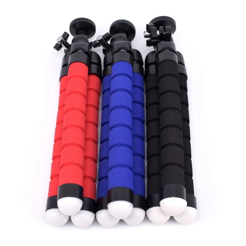 Black flexible octopus tripod wrapped around pole holding smartphone