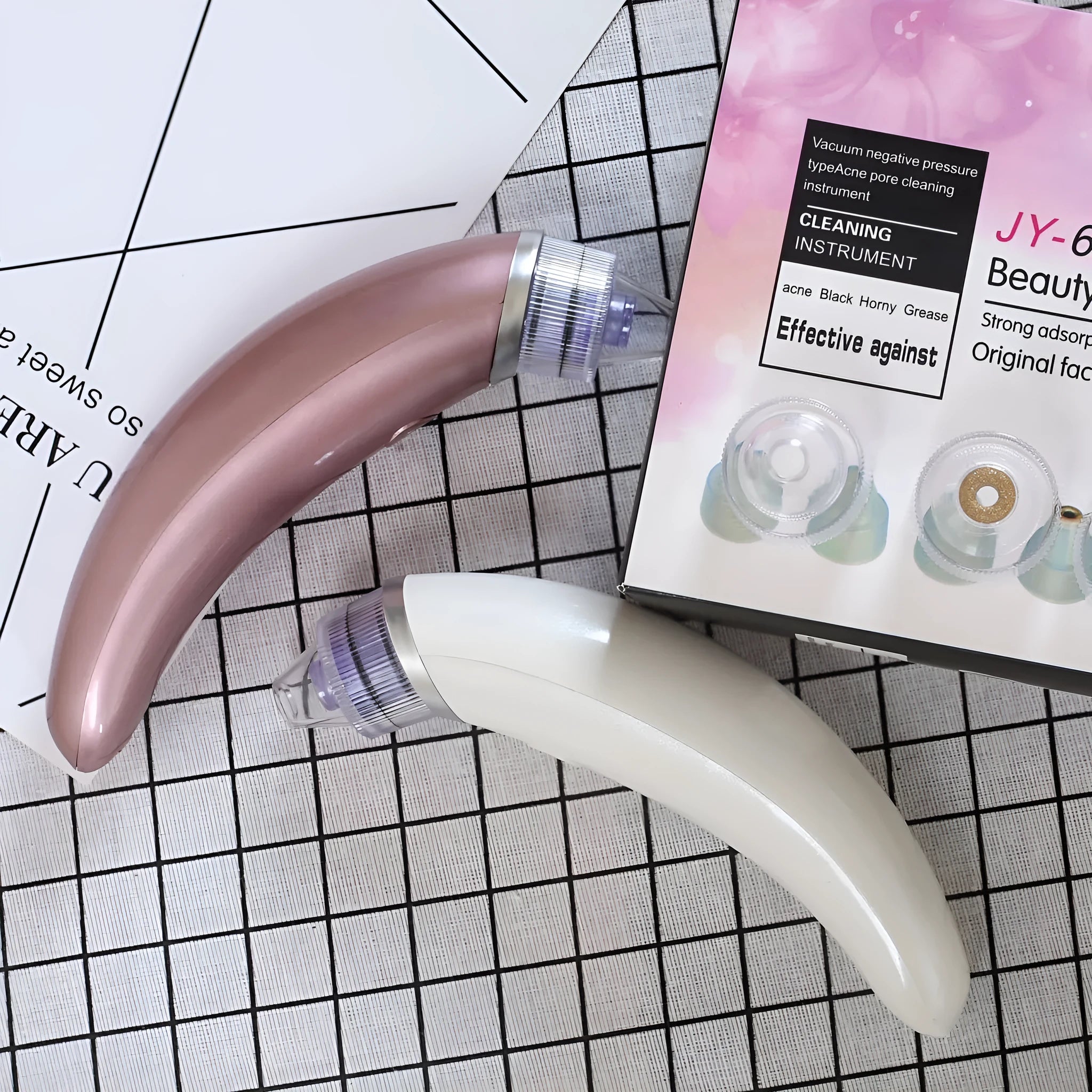 Rose gold and white Pore Beauty Cleanser JY-666 electric blackhead suction instrument for face and nose.