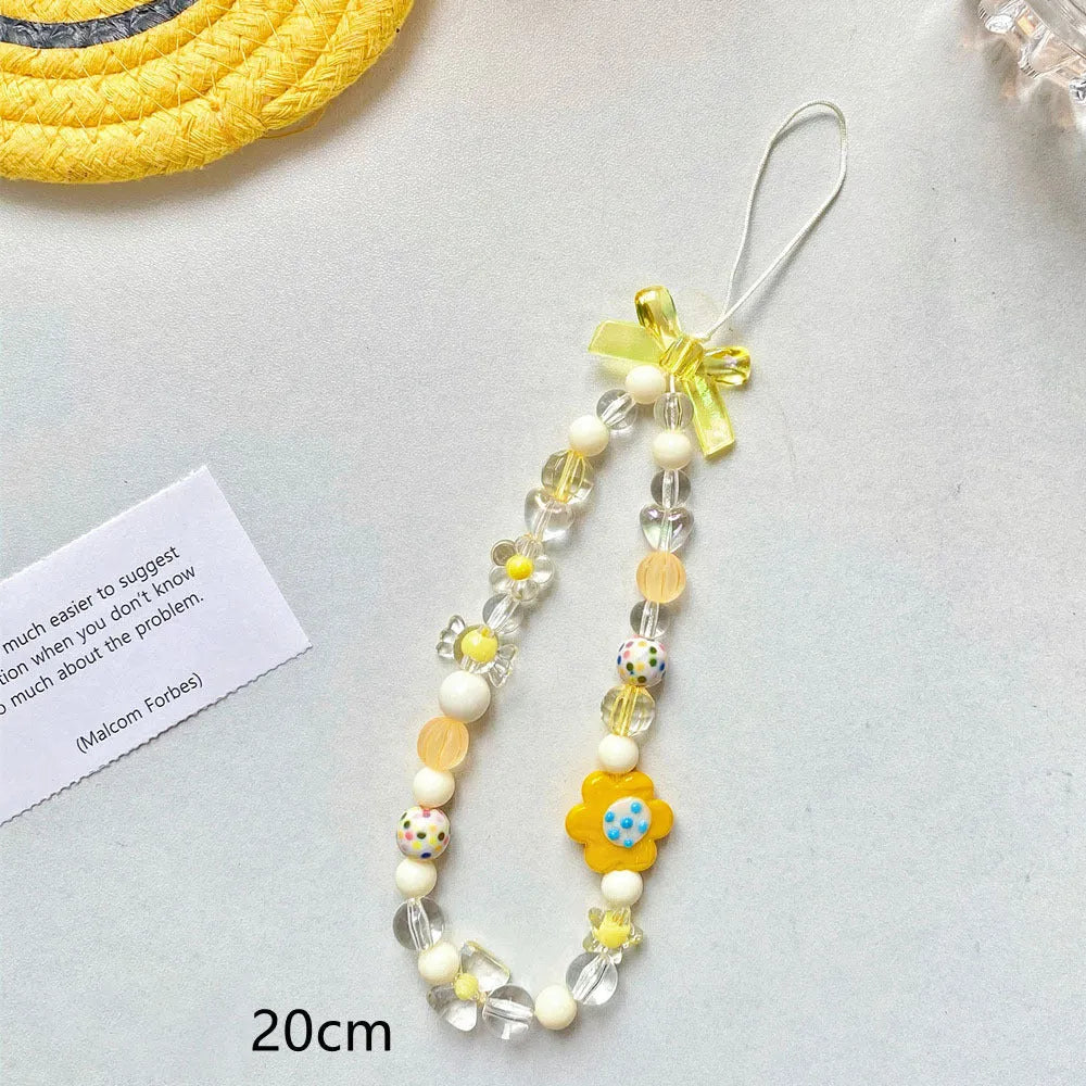 Beaded flower mobile phone lanyard with plastic resin decorations in blue, pink or yellow colour options