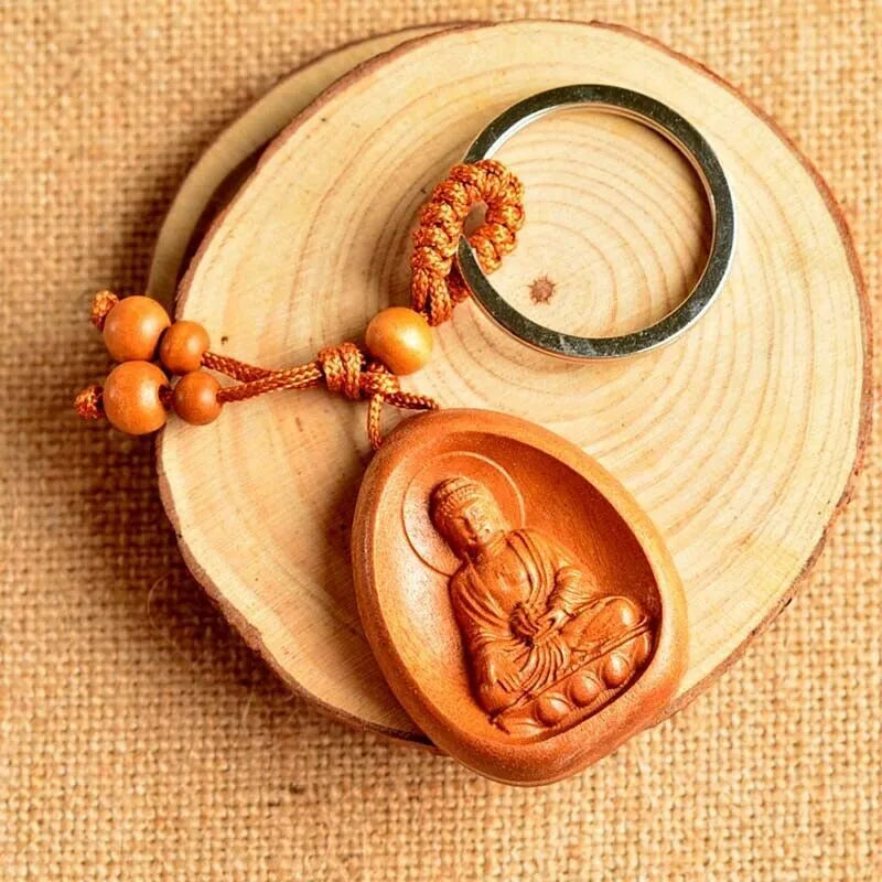 Eight patron saint keychains in peach wood colour, each 10 x 3.2 x 4 cm, Taomu Buddhist keychain set
