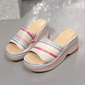 Colourful wave print wedge sandals for women on a beige background, showing fish mouth toe and thick sole.