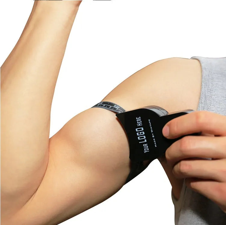 Black ABS plastic body fat skinfold caliper with measurement scale.