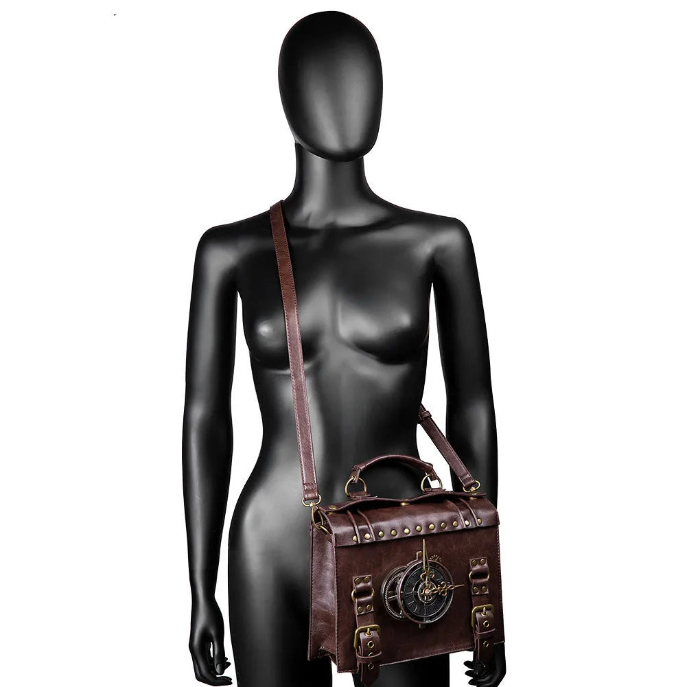 Bronze steampunk pillow shoulder bag with metal hardware on a textured PU leather surface.