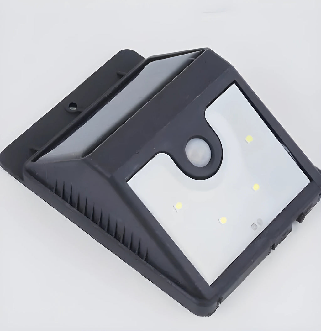 Four solar-powered LED sensor lights for outdoor garden and security lighting