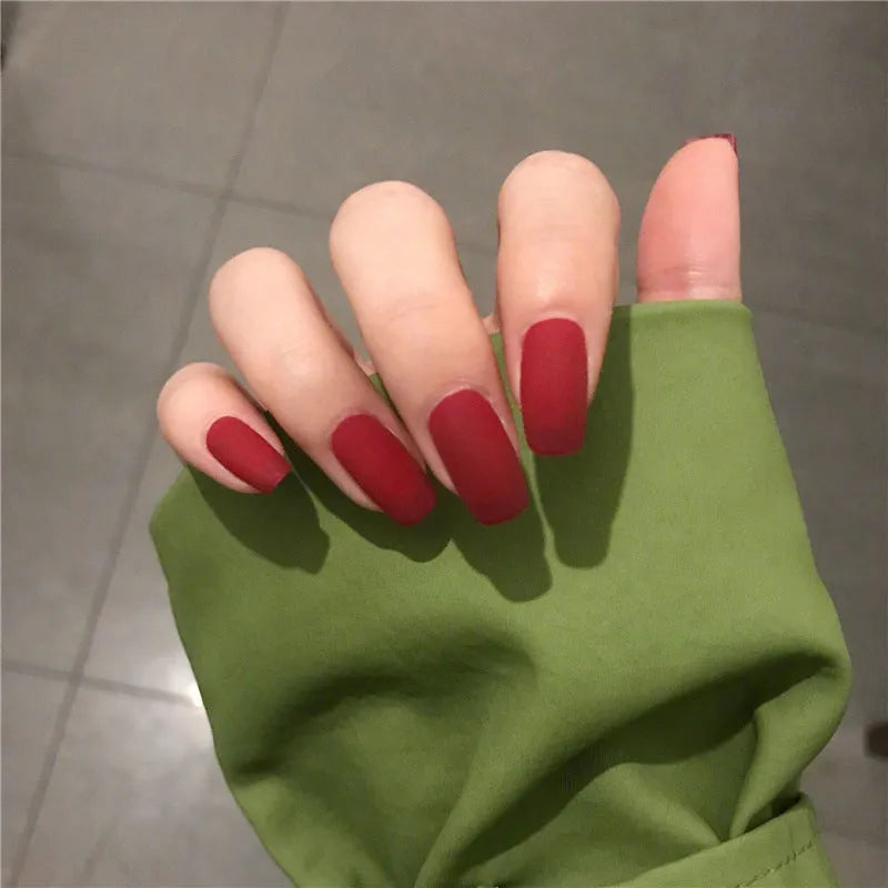 24-piece matte red medium length false nail set with glue-on application, approximately 27g net content