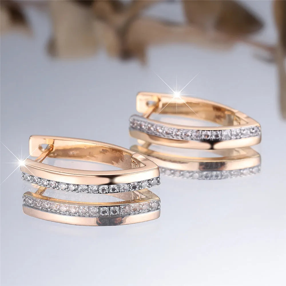 Women's V-shaped geometric earrings in champagne gold white diamond colour with electroplated copper construction