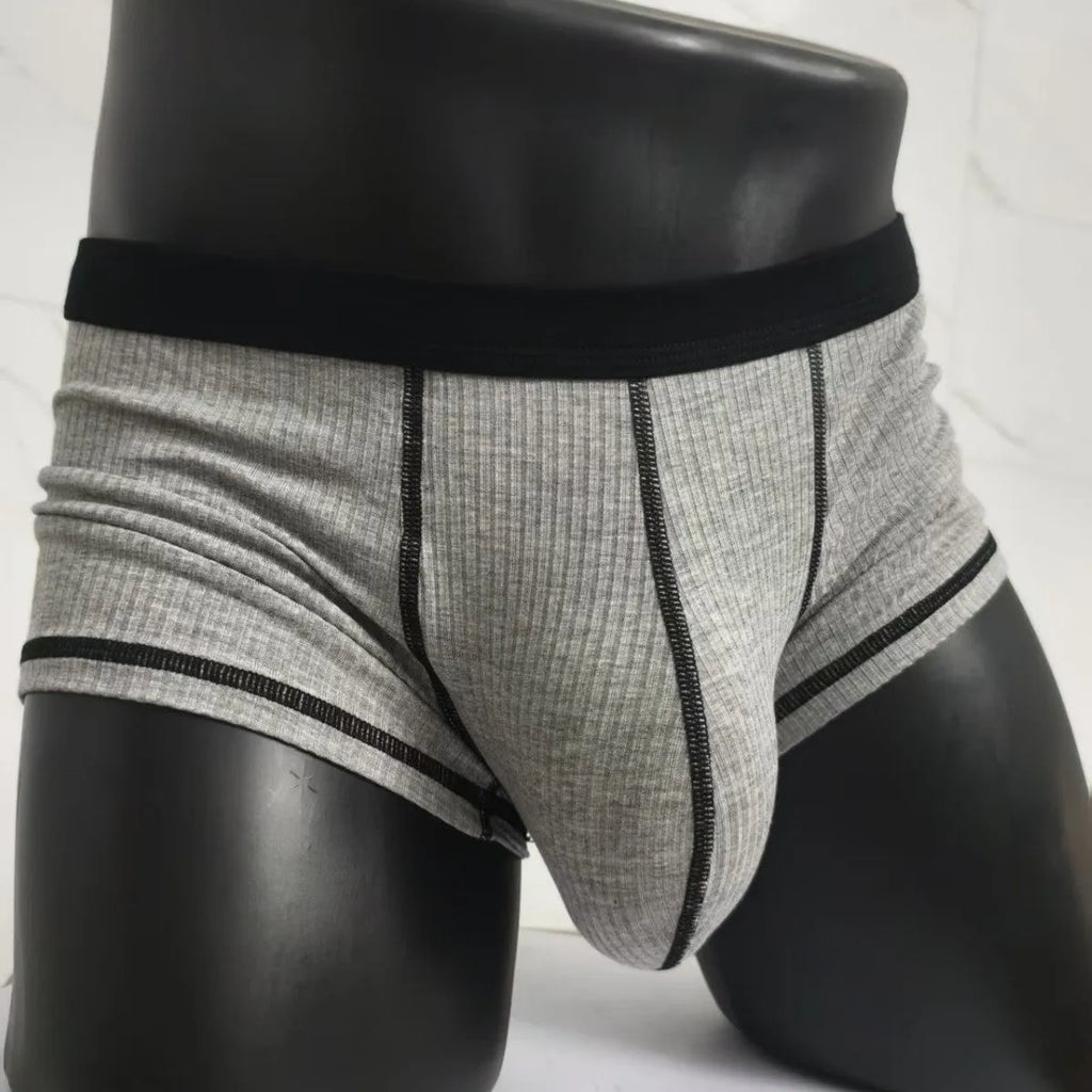 Men's solid colour boxer shorts in Army Green on a white background, showing the breathable fibre fabric.