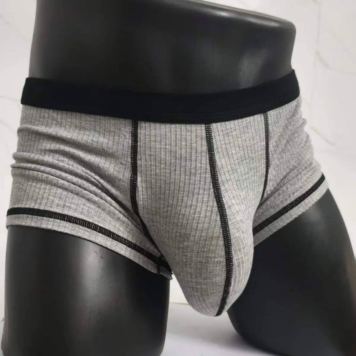 Men's solid colour boxer shorts in Army Green on a white background, showing the breathable fibre fabric.