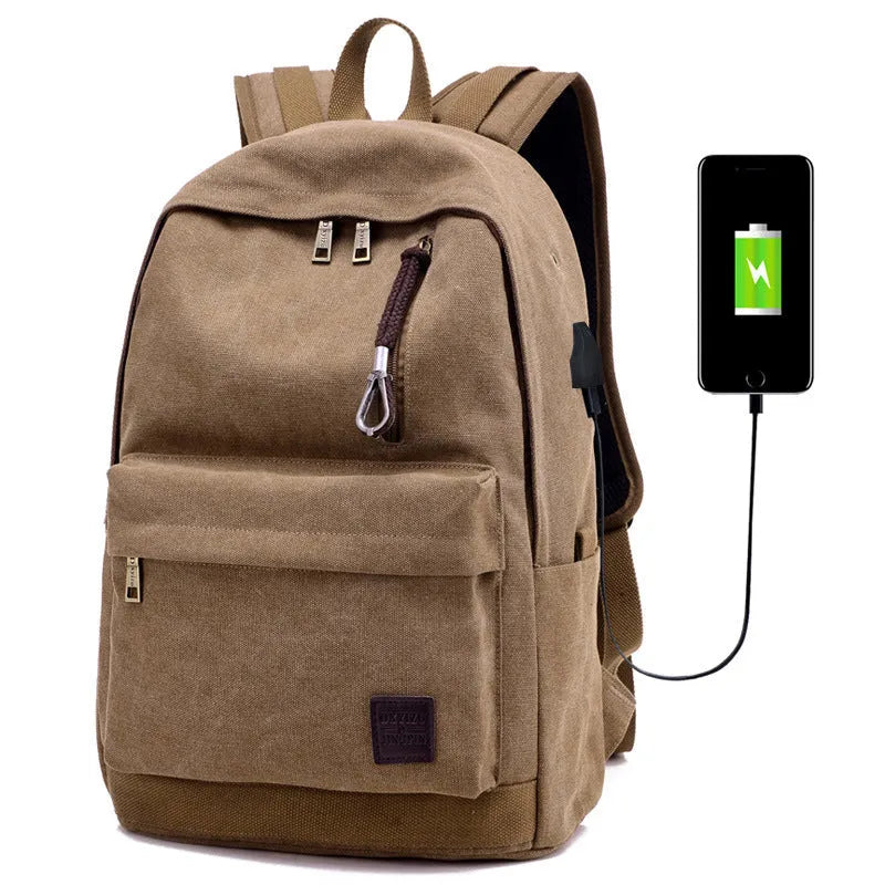 Canvas backpack with USB charging port shown in grey, featuring a laptop sleeve and front zipper pocket.