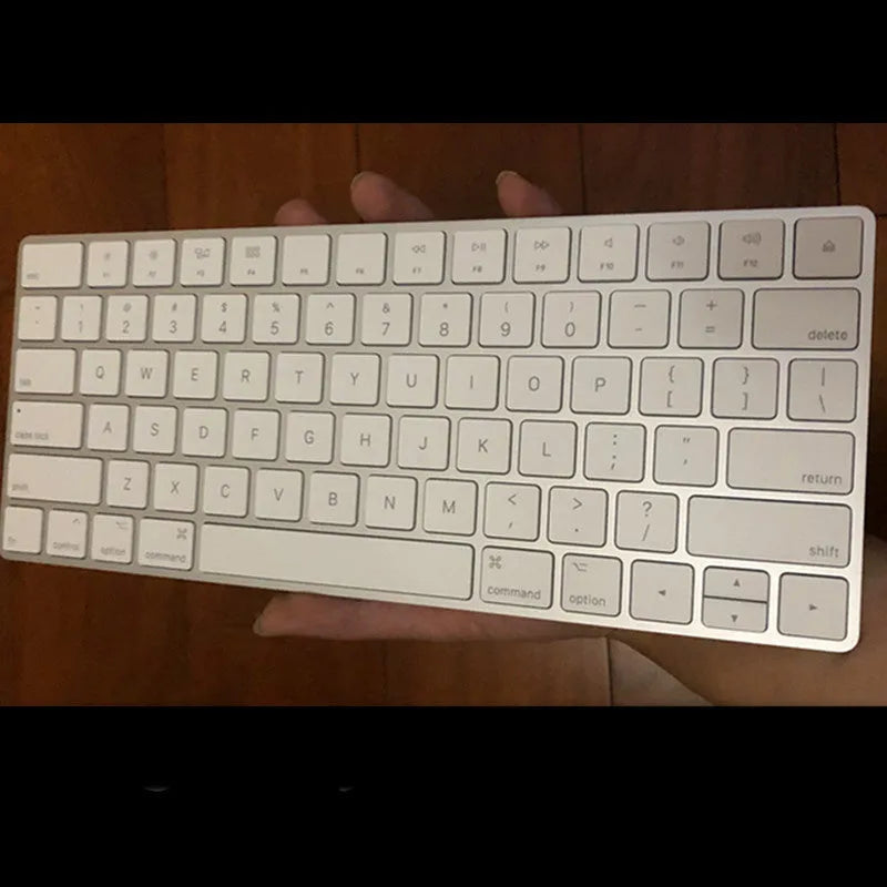 White Apple G6 Bluetooth wireless keyboard with ultra-thin metal construction and multimedia keys