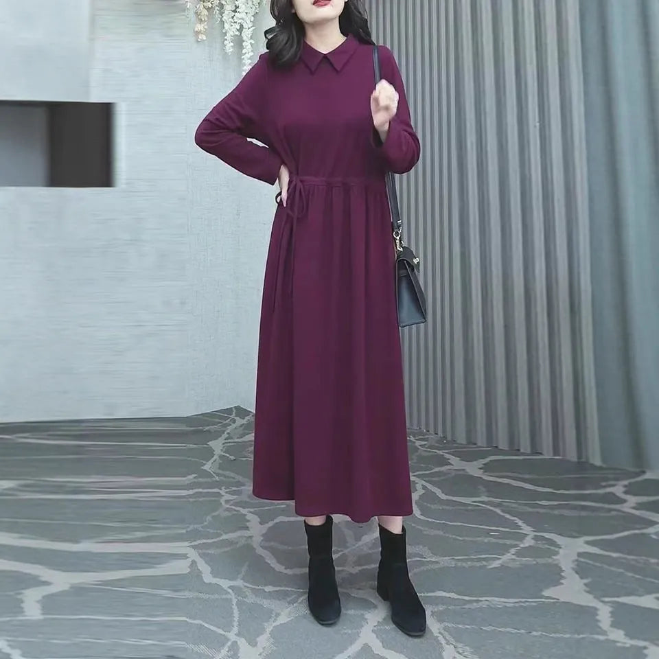 Purplish red women's long sleeve midi dress for winter, shown in a plus size.