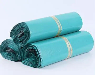 A bundle of 100 clear and coloured PE plastic courier bags with sticker seals for clothing protection.