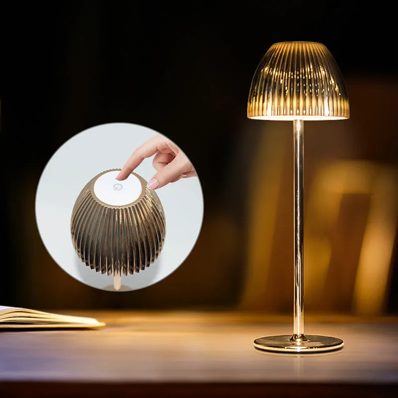Modern dimming desk lamp in black or white with a thin round base and USB cable.