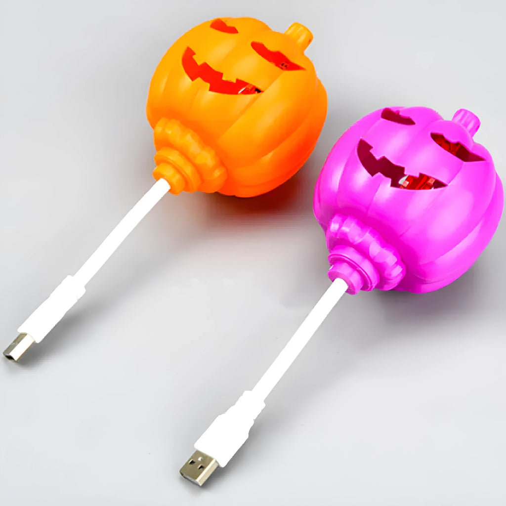 Plastic pumpkin lamp with USB cable showing yellow and purple light options
