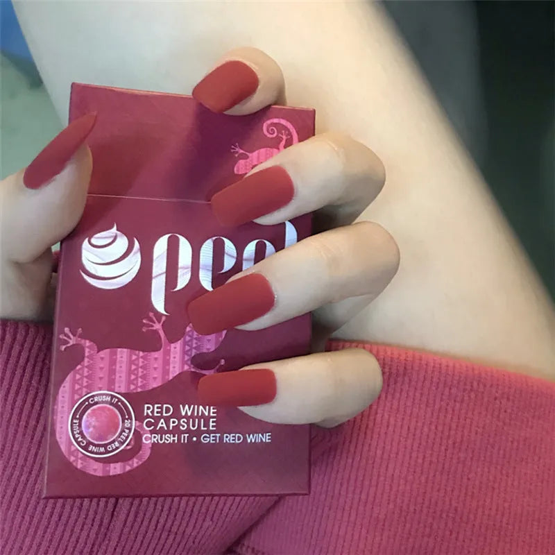 24-piece matte red medium length false nail set with glue-on application, approximately 27g net content