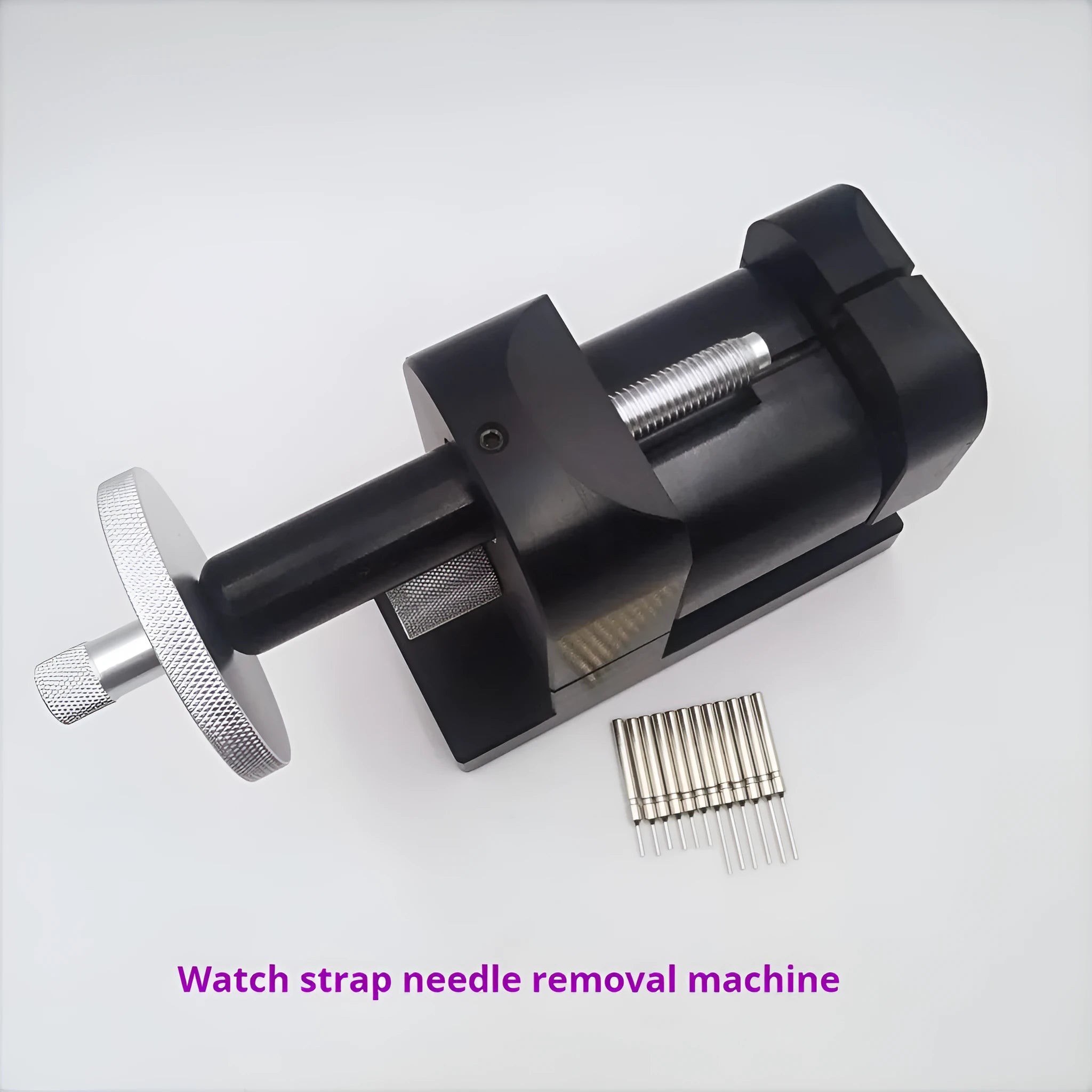 Alloy steel watch strap removal machine tool on a bench, showing compact size and components.