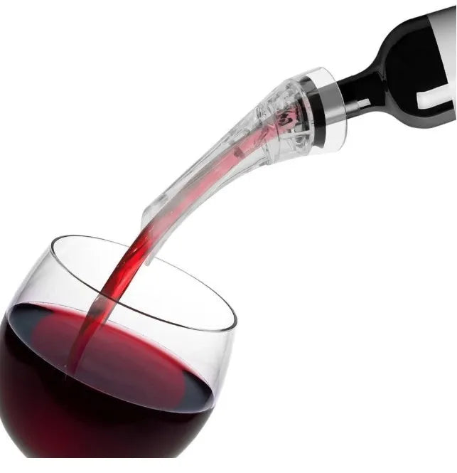 Clear acrylic wine aerator with stainless steel filter measuring 16x4.2cm pouring red wine into a glass