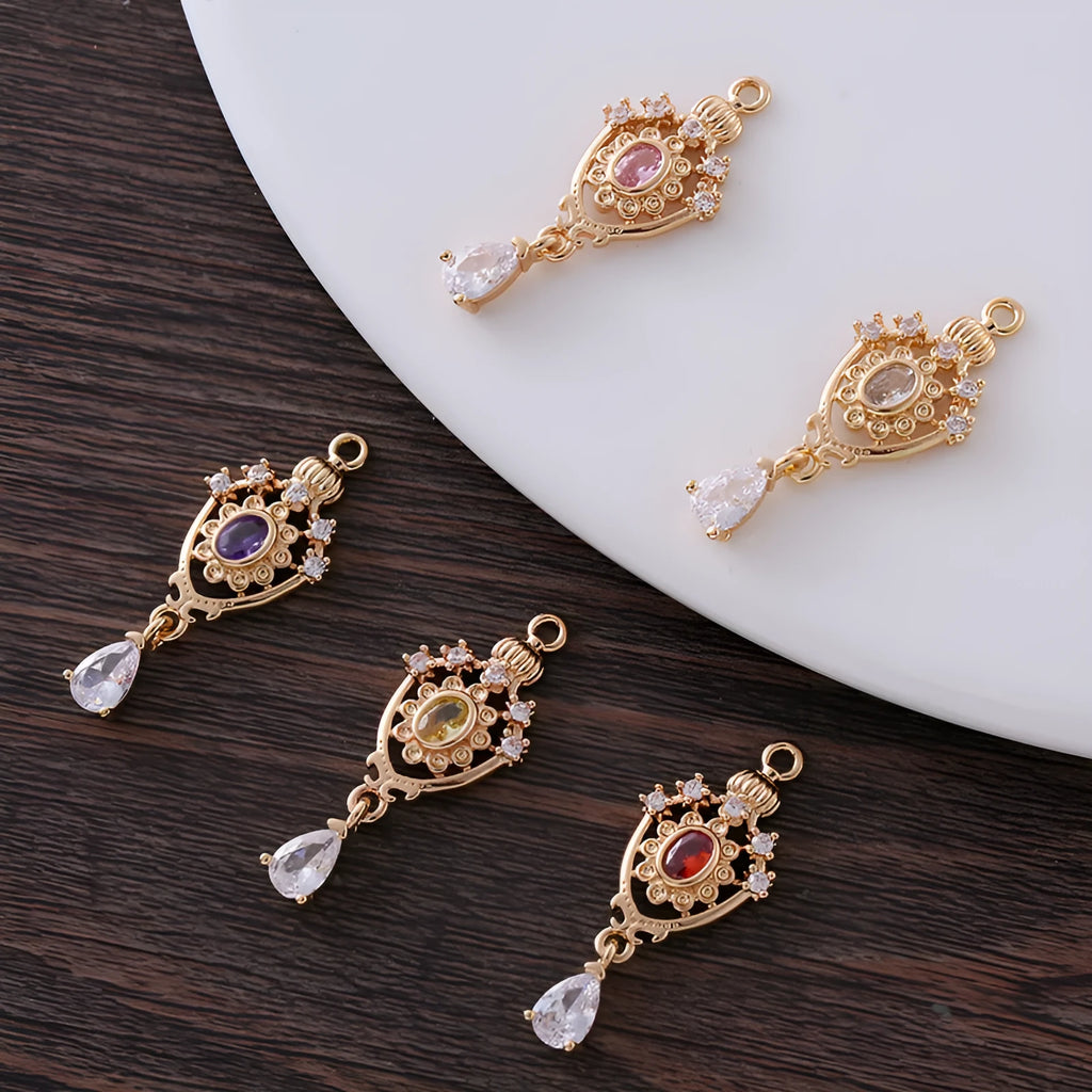 Copper crown water drop pendant with micro inlaid zircon detail in five colour options on white background