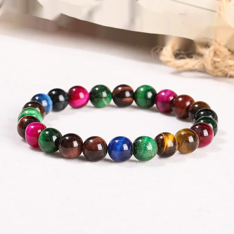 Colourful tiger eye bracelet with natural gemstone beads in multiple sizes on mixed string