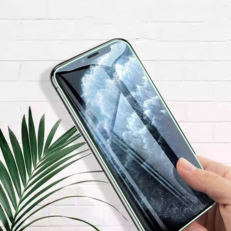 Luminous full cover tempered glass screen protector for iPhone glowing in dark with anti-scratch features.