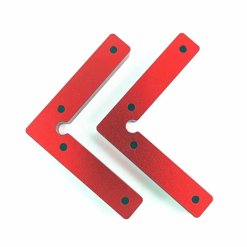 Aluminium right angle woodworking positioning block or jig on a workbench.