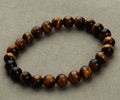 Natural stone round bead bracelet in aventurine blue sandstone with geometric design on white background