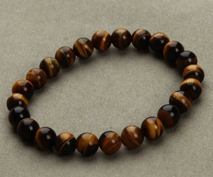 Natural stone round bead bracelet in aventurine blue sandstone with geometric design on white background