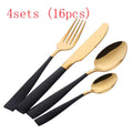 Black stainless steel four-piece cutlery set with mirror-polished finish on a plain surface