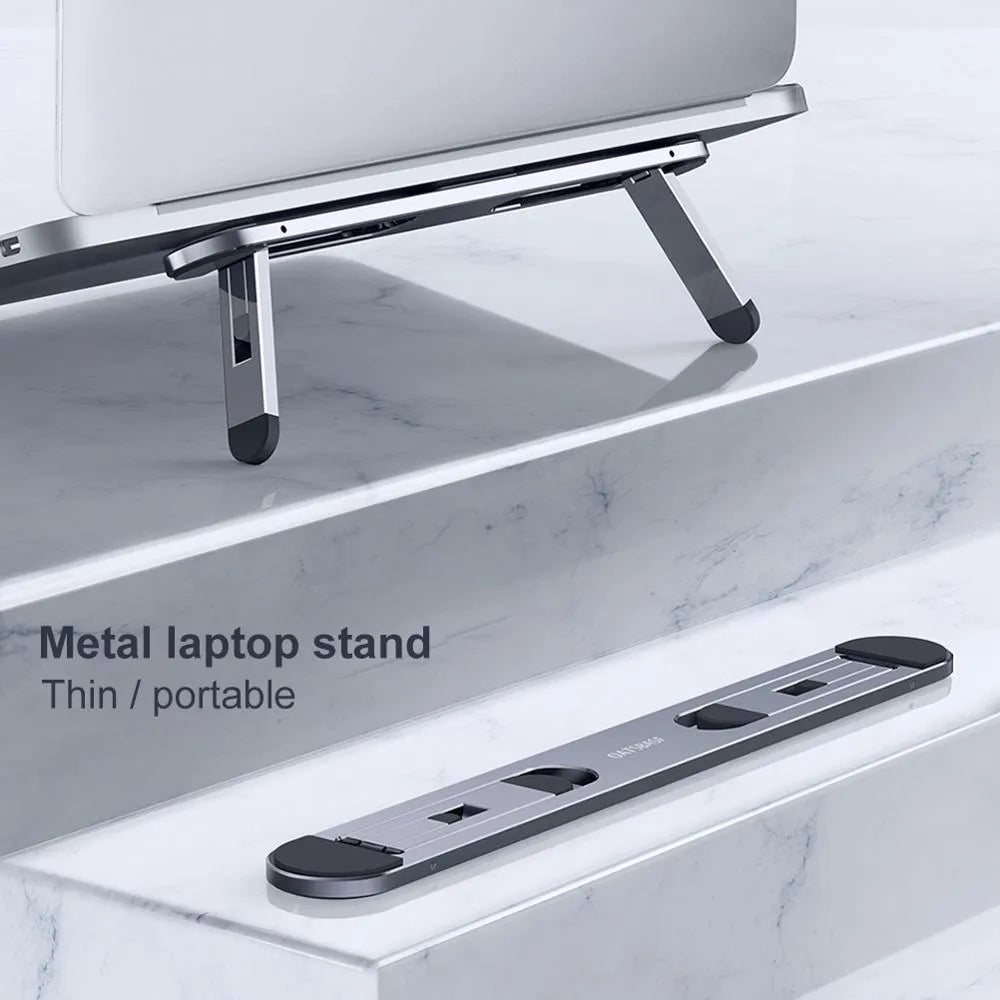 Aluminium alloy laptop stand 216x26mm in silver with silicone pads on desk