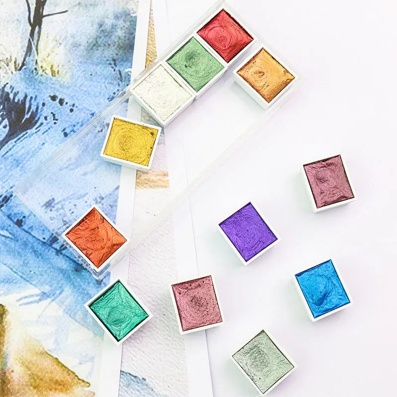 Solid watercolour pigment set showing pearlescent colour blocks in organised box