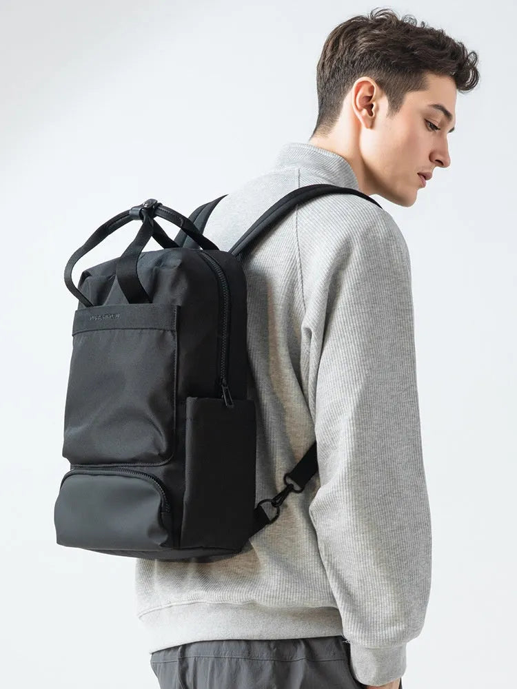 Black Oxford cloth computer backpack showing main compartment and 20-35 litre capacity.