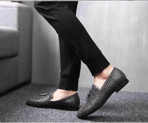 Anyaman men's woven loafers in black with soft sole, side view showing handcrafted weave texture