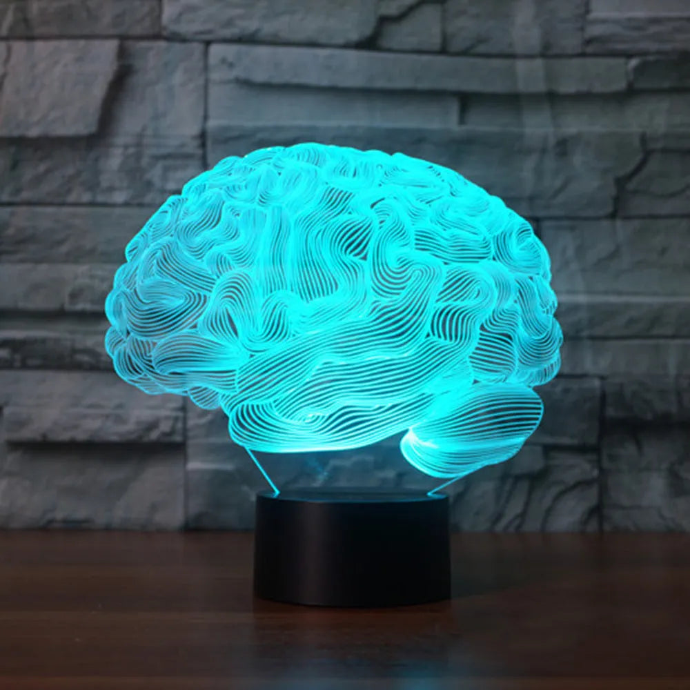 LED 3D acrylic illusion desk lamp with colourful remote control on a wooden table