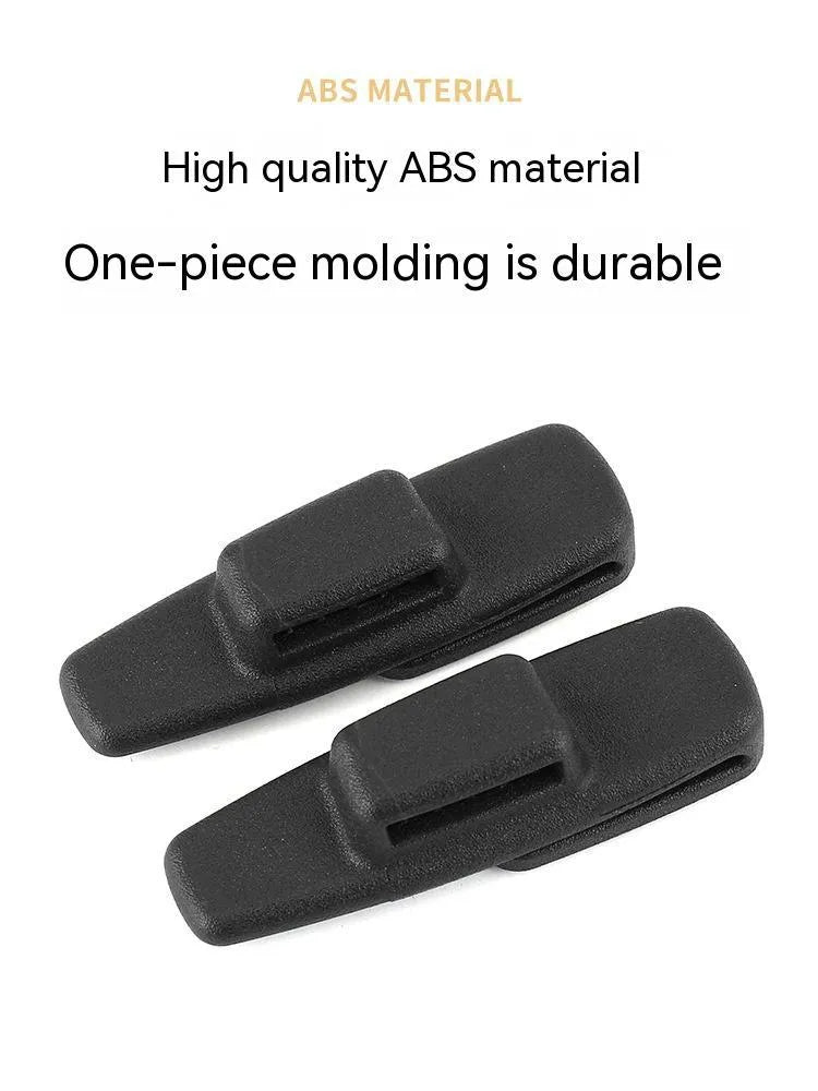 Two black ABS plastic car safety belt stopper clips for universal seatbelt tension adjustment