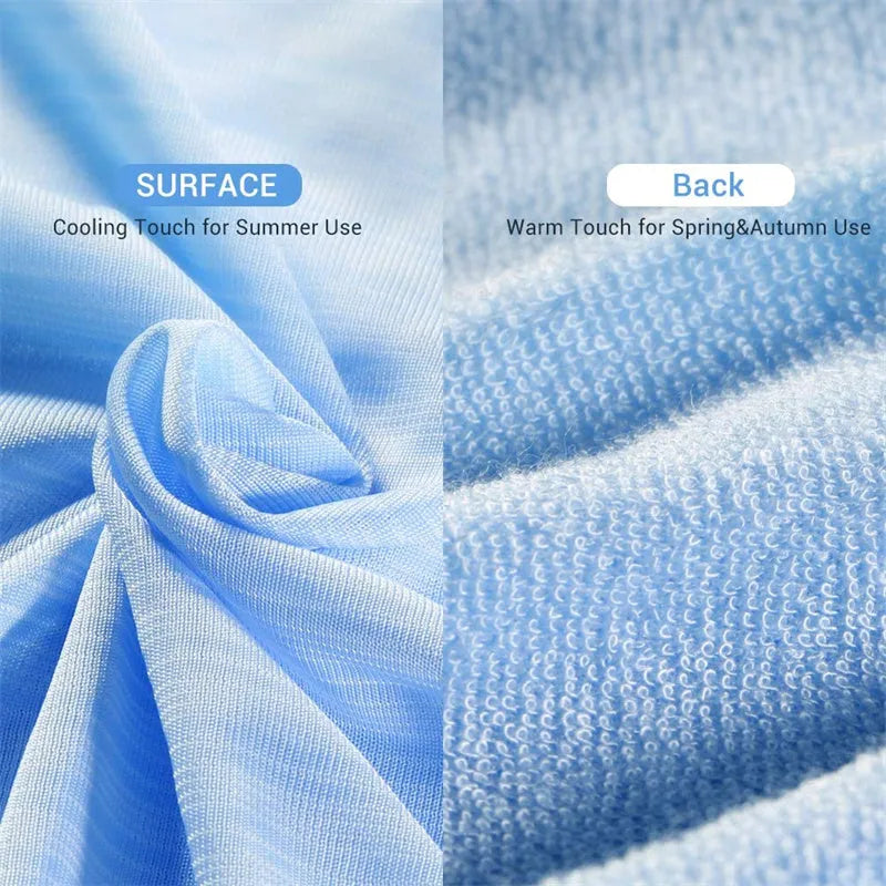 Blue cooling blanket with double-faced texture on a bed, showing its lightweight drape.