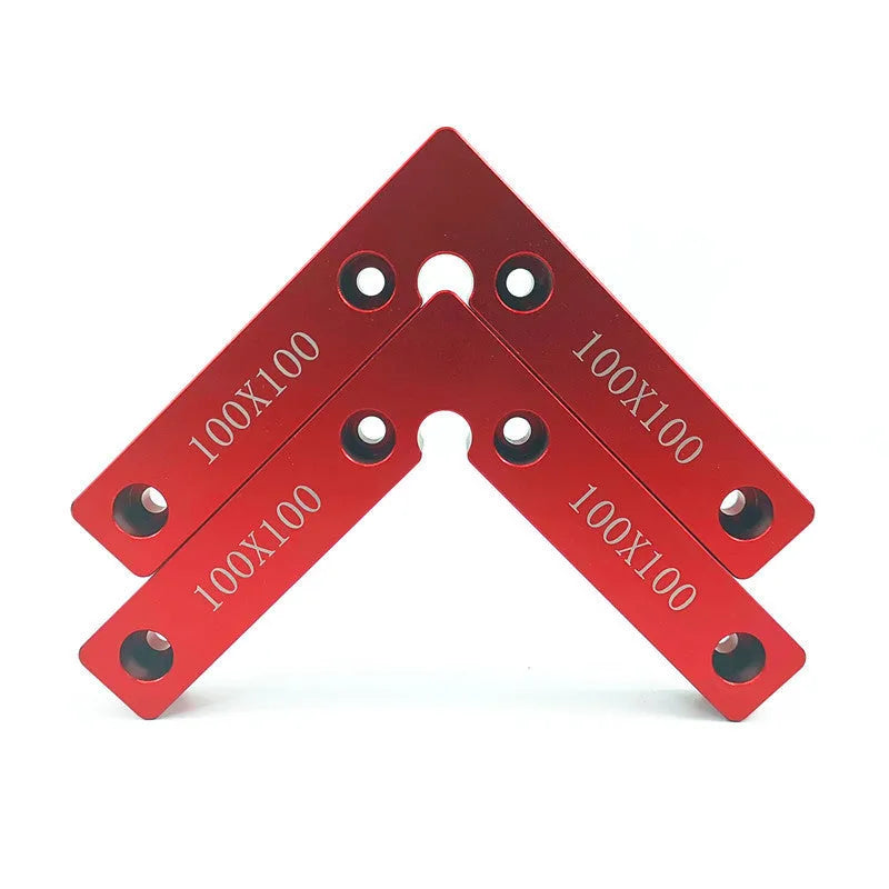 Aluminium right angle woodworking positioning block or jig on a workbench.