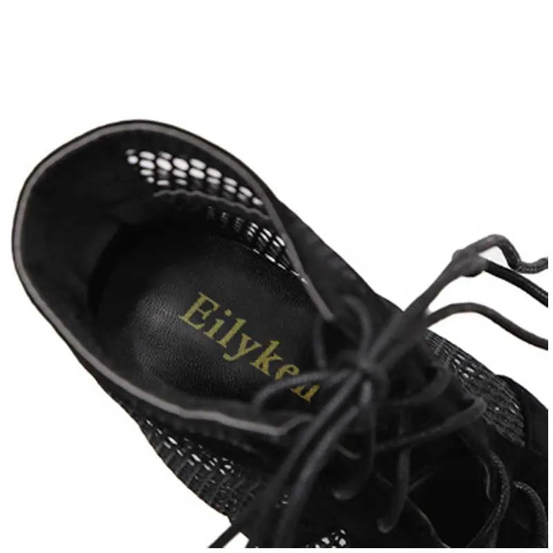 Black suede women's lace-up high heels with a high heel on a white background.