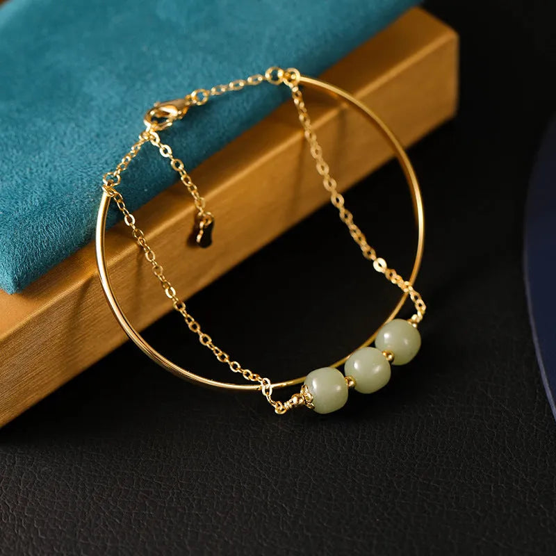 Women's Hetian jade bracelet with gold inlay design available in single, double or three bead versions