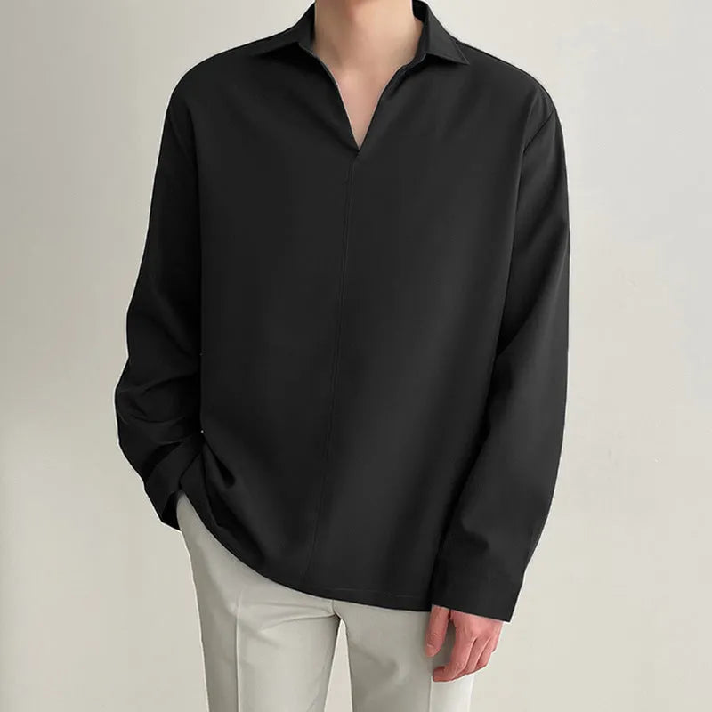 Men's loose lapels casual long sleeve shirt in a solid colour on a hanger.