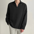 Men's loose lapels casual long sleeve shirt in a solid colour on a hanger.