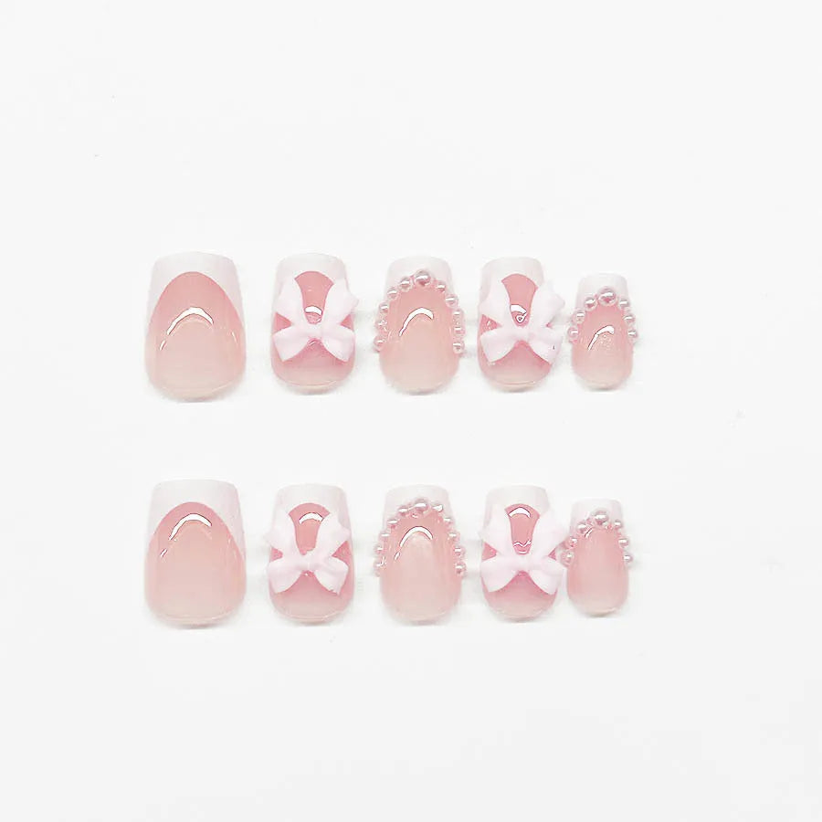 Short white French false nails with cute bow and tulip patterns in sweet style for ladies