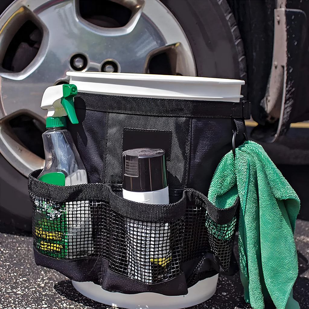 Black cylindrical polyester storage bag fitted onto a 5-gallon bucket for holding car wash tools and fishing gear.