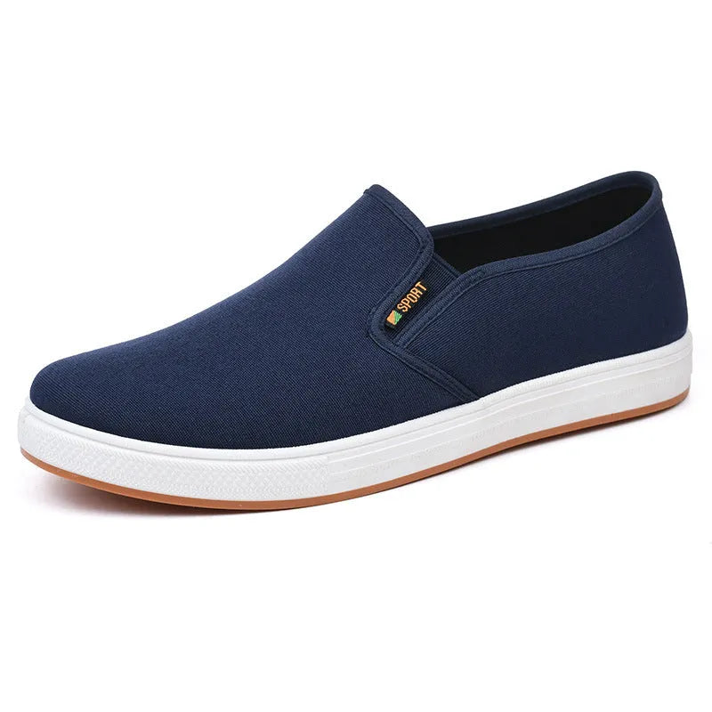 Men's black and blue canvas slip-on shoes with shallow cut design and composite soles