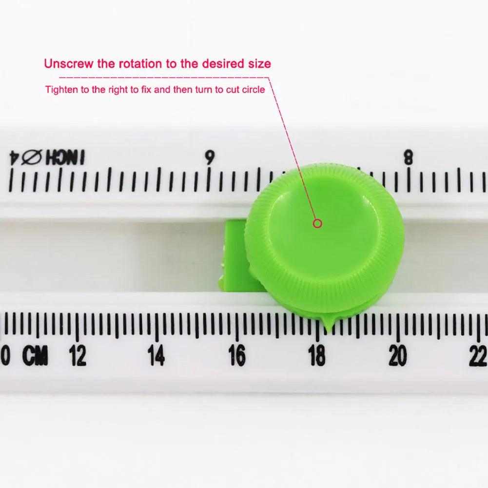 Orange plastic round paper cutter for A3 sheets on a desktop