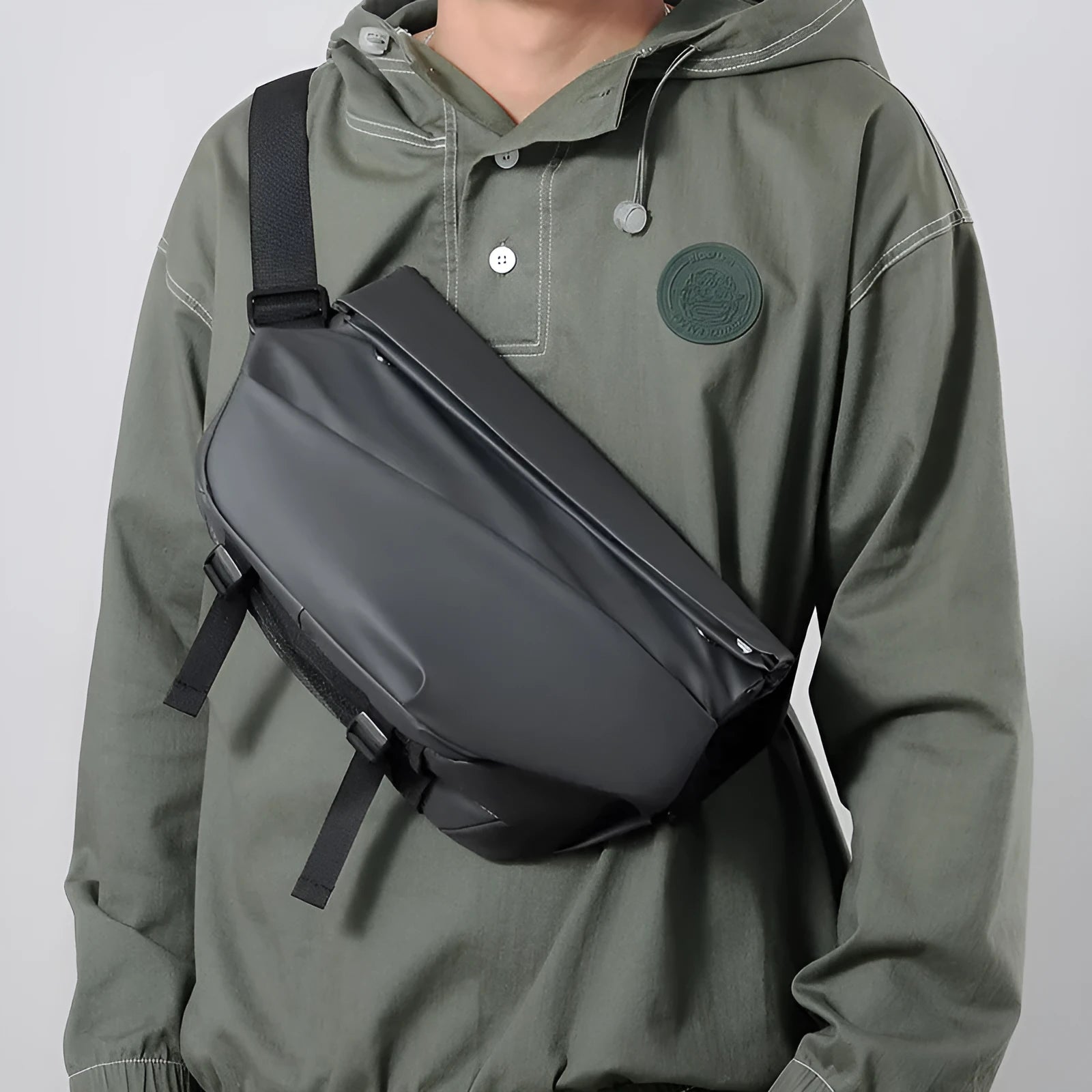 Men's grey medium crossbody bag with shoulder strap showing internal phone and document pockets