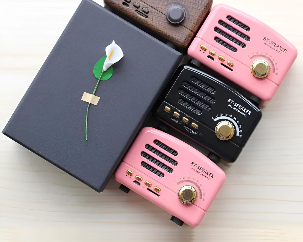 Vintage wood finish Bluetooth speaker in compact plastic housing with USB charging port