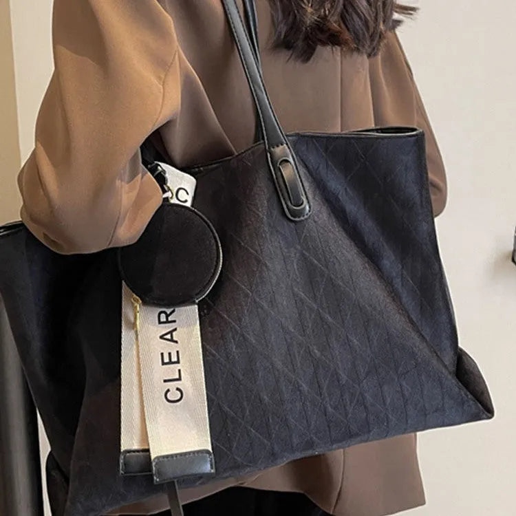 Large casual shoulder bag in horizontal square shape with sandwich pocket design and zip internal compartment