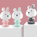 Cartoon-style animal table lamp with plastic shade in Bear, Cattle, Rabbit, or Tiger design.