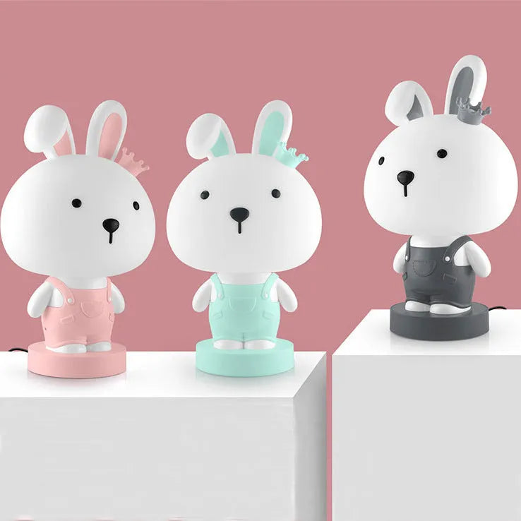 Cartoon-style animal table lamp with plastic shade in Bear, Cattle, Rabbit, or Tiger design.