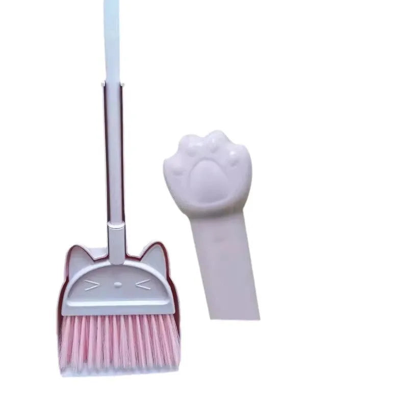Purple broom and dustpan set with rotating brush holder on white background